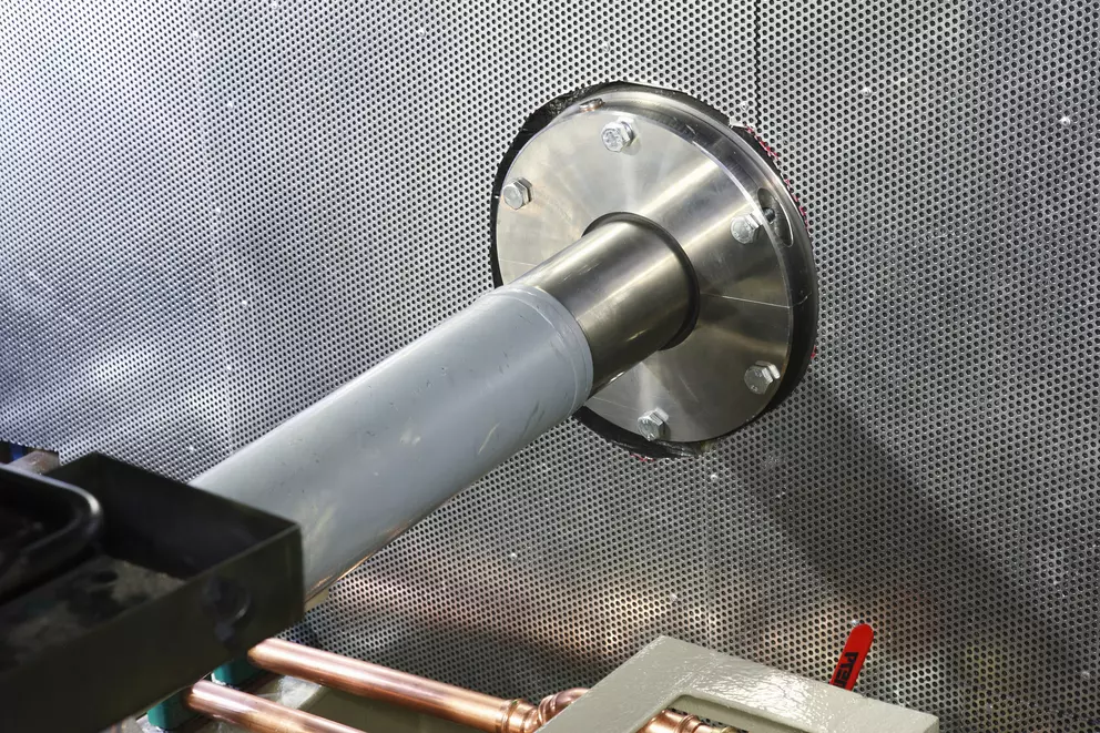 Shaft sealing assembly mounted through industrial equipment housing.