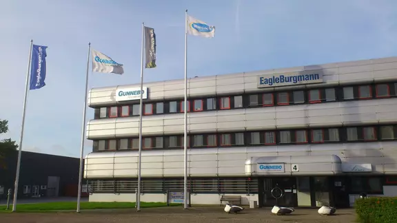 EagleBurgmann office building with company signage and flagpoles in front of a modern commercial facade.