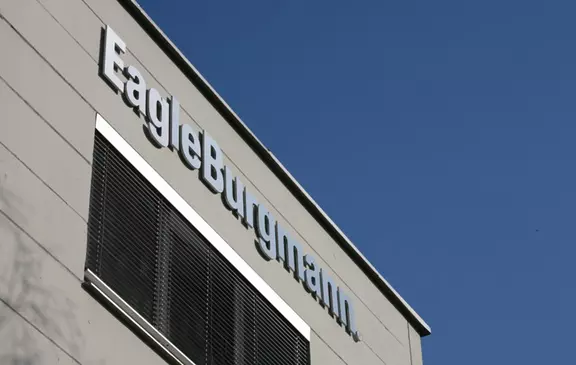 EagleBurgmann company sign on the building facade against a clear blue sky, highlighting the company’s brand presence.
