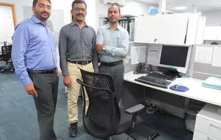 EagleBurgmann employees in an ergonomic office workspace, promoting health, comfort, and productivity through improved workplace design and posture awareness.