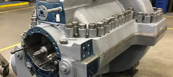 Heavy-duty industrial compressor or pump housing with exposed shaft and bolted casing for maintenance, overhaul, or mechanical seal installation.